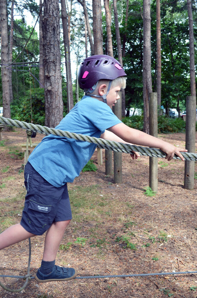 Young boy on the low ropes