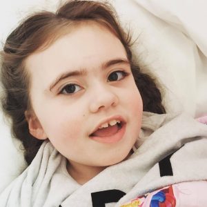 Beautiful SMS child smiling at the camera