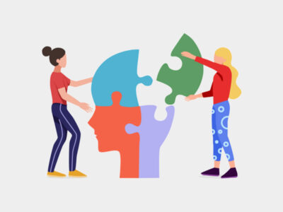 illustration of two people putting puzzles pieces together in the shape of a head
