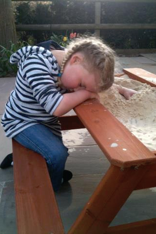 child asleep in the sandpit showing disturbed sleep pattern with SMS