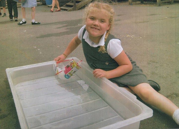 little girl with SMS at school